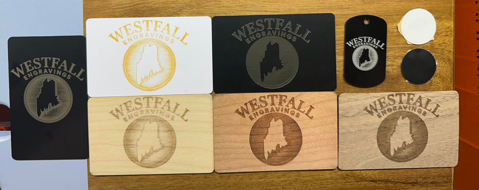 A range of engraved TAP NFC business card materials